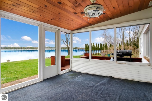 12225 SW Torch Lake Dr SW, Rapid City, MI 49676 - sunroom / solarium featuring lofted ceiling, a water view, and a ceiling fan
