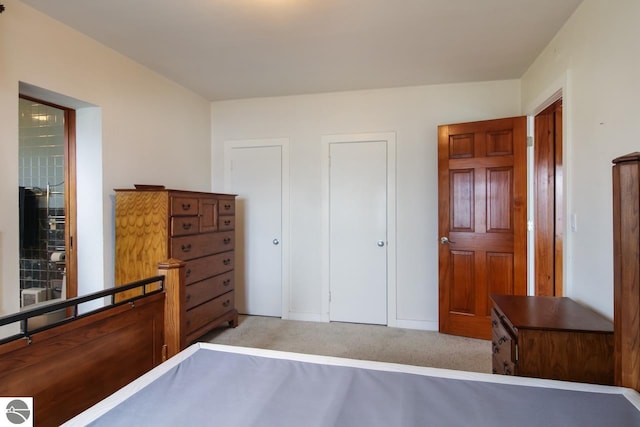 12225 SW Torch Lake Dr SW, Rapid City, MI 49676 - bedroom with light colored carpet