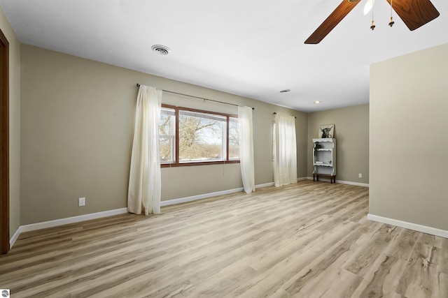 8481 E Houghton Lake Rd, Merritt, MI 49667 - spare room featuring ceiling fan, light wood-style floors, and baseboards