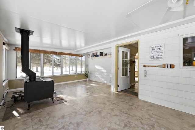 8481 E Houghton Lake Rd, Merritt, MI 49667 - living area featuring a wood stove