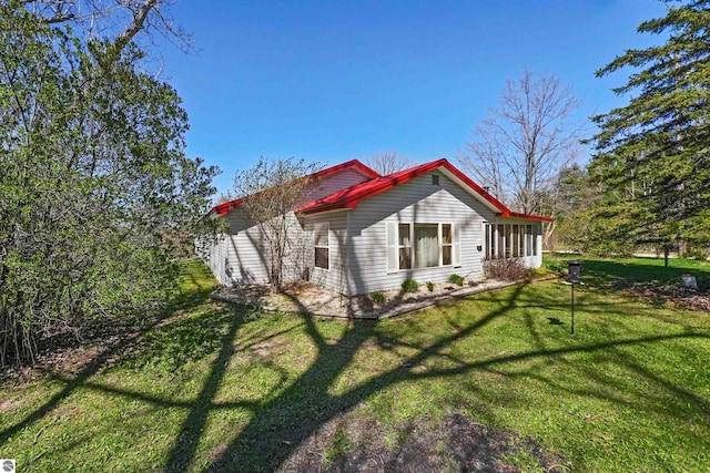 8481 E Houghton Lake Rd, Merritt, MI 49667 - view of property exterior featuring a yard