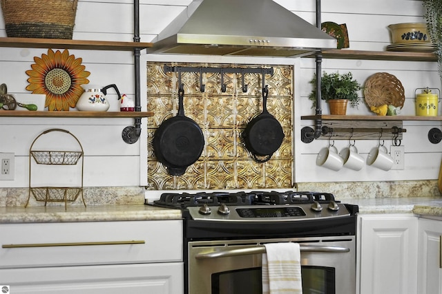 8481 E Houghton Lake Rd, Merritt, MI 49667 - kitchen with stainless steel range with gas stovetop, ventilation hood, open shelves, light countertops, and white cabinetry