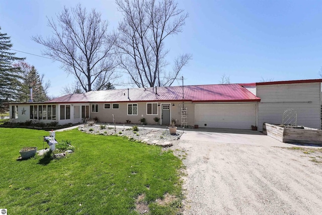 8481 E Houghton Lake Rd, Merritt, MI 49667 - single story home featuring concrete driveway, a garage, metal roof, a front lawn, and a sunroom