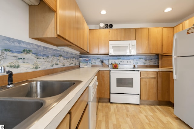 kitchen with white appliances, light wood-style flooring, light countertops, backsplash, and recessed lighting
