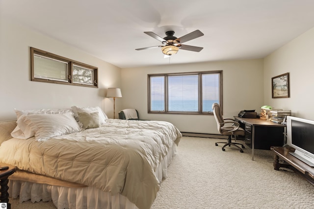 bedroom featuring baseboard heating, carpet, and ceiling fan