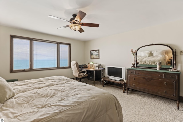 bedroom with light colored carpet and a ceiling fan