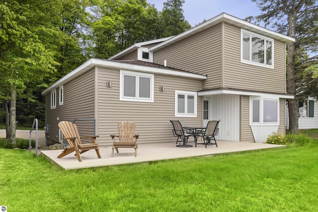 back of house with a yard