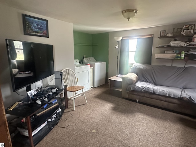 carpeted living room with washer and clothes dryer