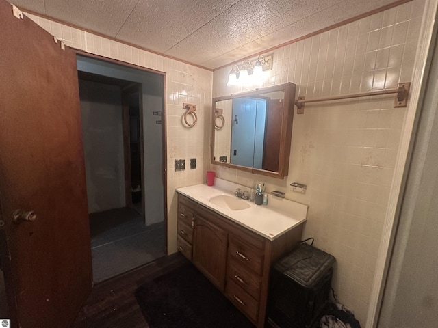 bathroom with vanity and a textured ceiling