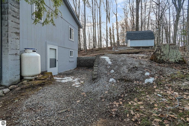 view of side of property with an outdoor structure