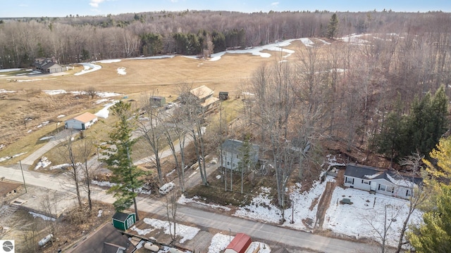 aerial overview of property's location with a heavily wooded area