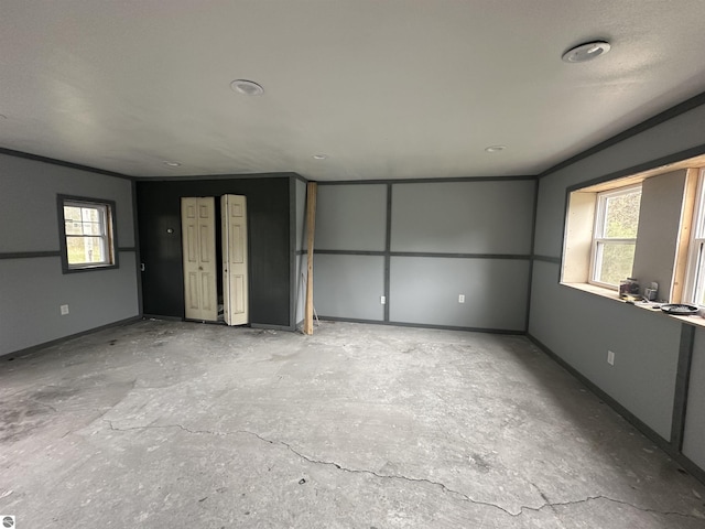 spare room featuring baseboards