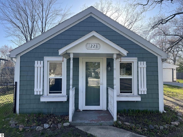view of front of property featuring fence