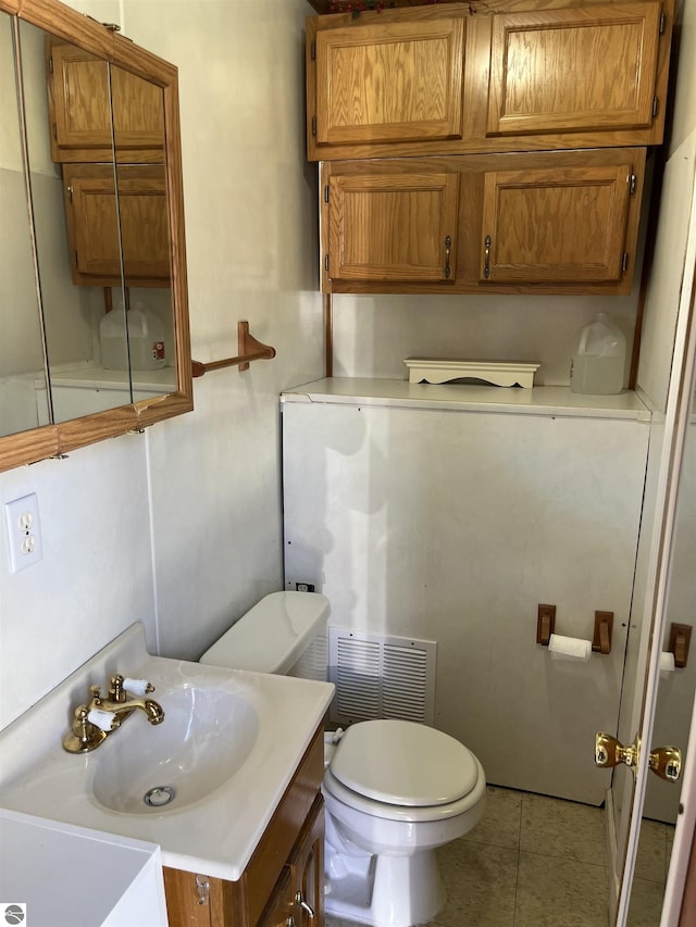 15831 SE M 72, Grayling, MI 49738 - half bath featuring toilet, tile patterned flooring, and vanity