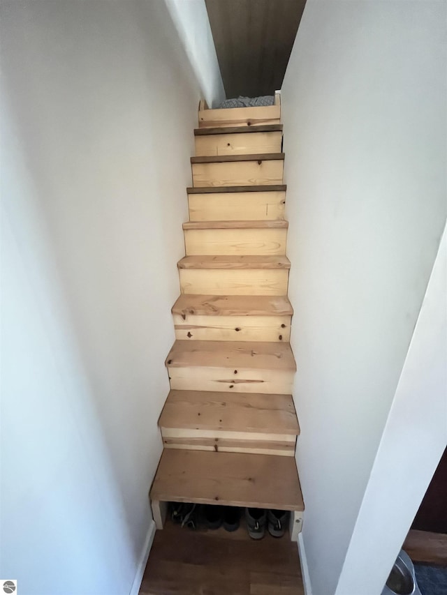 15831 SE M 72, Grayling, MI 49738 - staircase featuring wood finished floors and baseboards