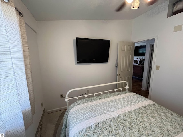 15831 SE M 72, Grayling, MI 49738 - carpeted bedroom with baseboards and a ceiling fan