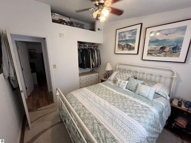 15831 SE M 72, Grayling, MI 49738 - bedroom featuring a closet, ceiling fan, and wood finished floors