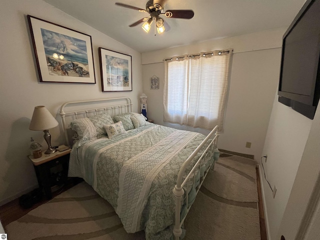 15831 SE M 72, Grayling, MI 49738 - bedroom with vaulted ceiling, baseboards, carpet flooring, and a ceiling fan