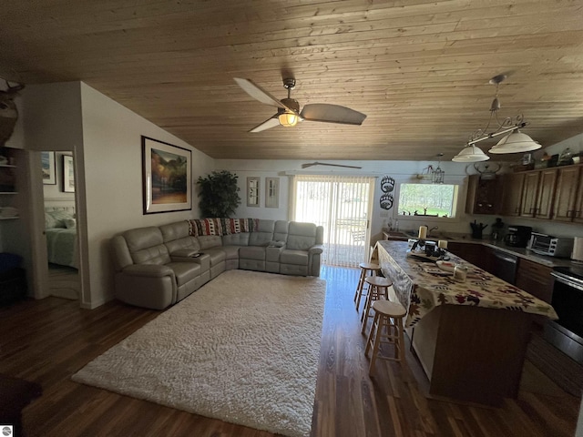 15831 SE M 72, Grayling, MI 49738 - living area with vaulted ceiling, wood ceiling, dark wood finished floors, and a ceiling fan
