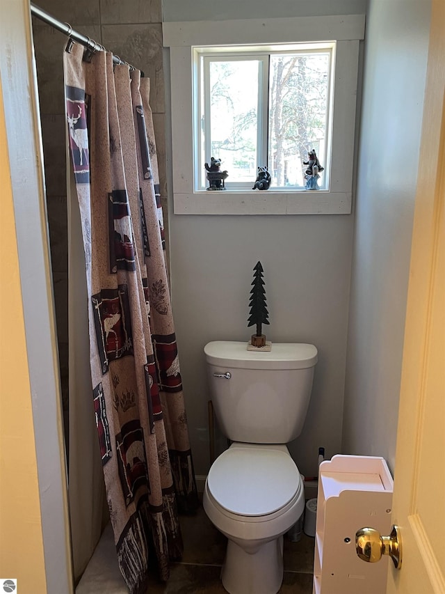 15831 SE M 72, Grayling, MI 49738 - bathroom with toilet and a shower with shower curtain