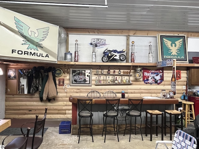 15831 SE M 72, Grayling, MI 49738 - bar with rustic walls and unfinished concrete floors