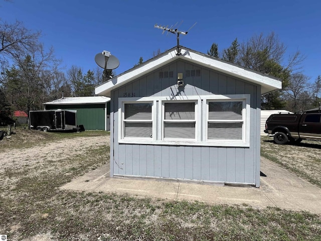 15831 SE M 72, Grayling, MI 49738 - view of home's exterior with an outdoor structure