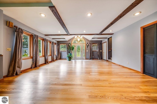 unfurnished living room featuring baseboards, light wood-type flooring, recessed lighting, and beam ceiling
