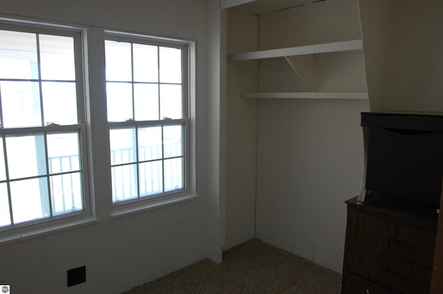 2993 N Ogemaw Trl, West Branch, MI 48661 - unfurnished bedroom featuring carpet floors