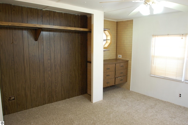 2993 N Ogemaw Trl, West Branch, MI 48661 - unfurnished bedroom featuring carpet flooring, a closet, and ceiling fan