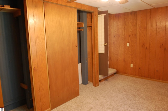 2993 N Ogemaw Trl, West Branch, MI 48661 - unfurnished bedroom featuring carpet and wooden walls