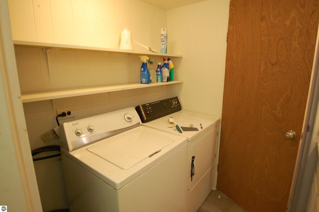 2993 N Ogemaw Trl, West Branch, MI 48661 - clothes washing area featuring independent washer and dryer