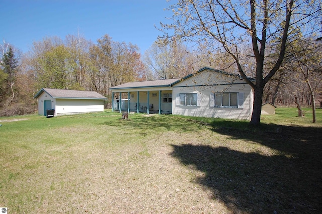 2993 N Ogemaw Trl, West Branch, MI 48661 - rear view of property featuring a lawn