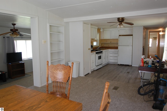 2993 N Ogemaw Trl, West Branch, MI 48661 - kitchen with white appliances, a ceiling fan, built in features, and white cabinets