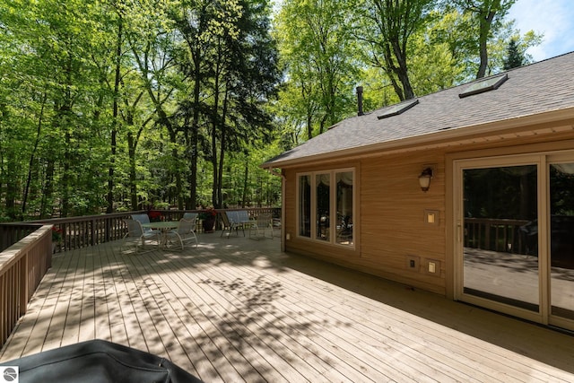 deck featuring outdoor dining area