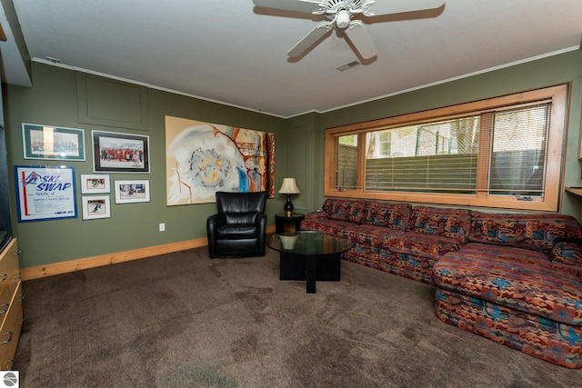 carpeted living room featuring crown molding, a ceiling fan, and baseboards