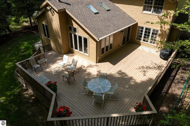 deck featuring outdoor dining area