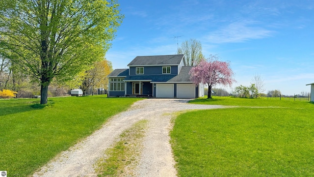 20202 50th Ave, Marion, MI 49665 - traditional-style house featuring dirt driveway, a front lawn, and a garage