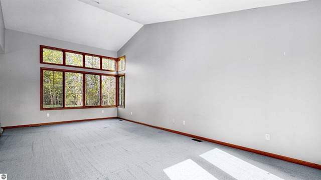 20202 50th Ave, Marion, MI 49665 - unfurnished room with baseboards, lofted ceiling, and carpet