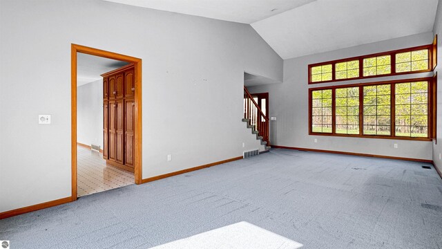 20202 50th Ave, Marion, MI 49665 - empty room with stairway, baseboards, carpet flooring, and lofted ceiling