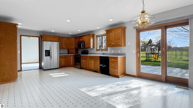 20202 50th Ave, Marion, MI 49665 - kitchen with appliances with stainless steel finishes, a chandelier, light countertops, pendant lighting, and recessed lighting