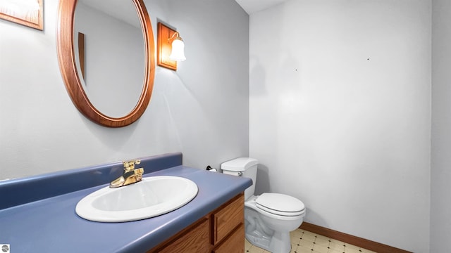20202 50th Ave, Marion, MI 49665 - bathroom with toilet, vanity, and tile patterned floors
