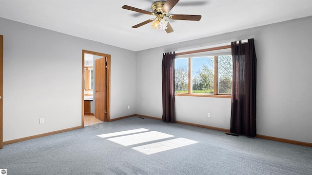 20202 50th Ave, Marion, MI 49665 - unfurnished room featuring carpet floors, baseboards, and a ceiling fan