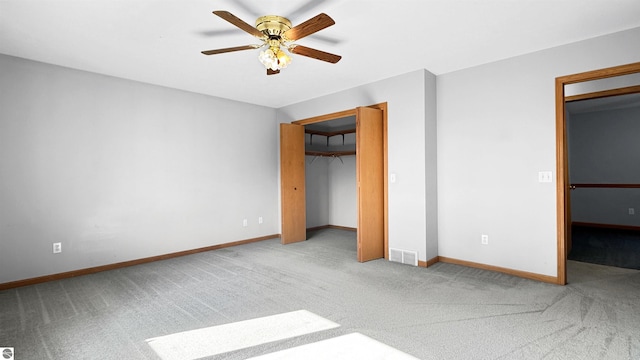 20202 50th Ave, Marion, MI 49665 - unfurnished bedroom featuring carpet flooring, baseboards, a closet, and ceiling fan