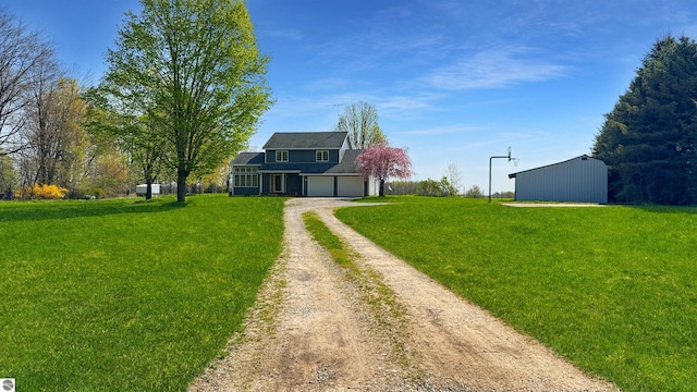 20202 50th Ave, Marion, MI 49665 - view of front of home with dirt driveway, a front lawn, and an attached garage
