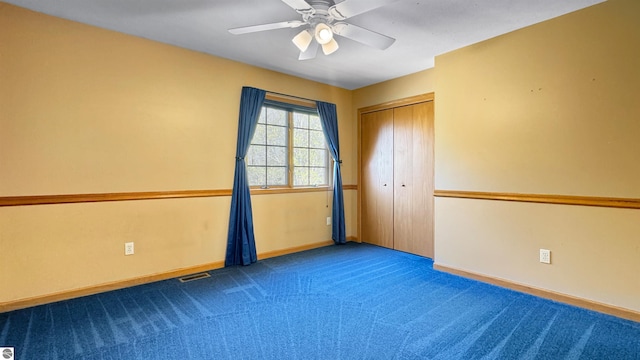 20202 50th Ave, Marion, MI 49665 - unfurnished bedroom featuring carpet floors, baseboards, a closet, and a ceiling fan