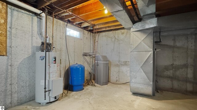20202 50th Ave, Marion, MI 49665 - below grade area with gas water heater and a water pressure tank