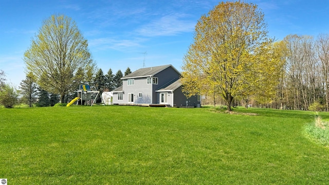 20202 50th Ave, Marion, MI 49665 - view of grassy yard with a playground and a deck