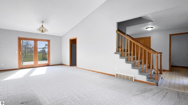 20202 50th Ave, Marion, MI 49665 - unfurnished living room featuring lofted ceiling, carpet floors, baseboards, and stairway
