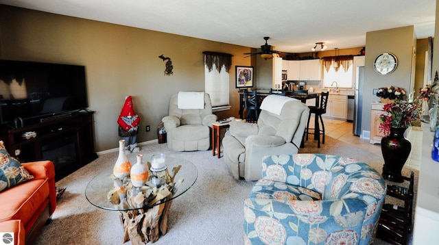11255 E Fort Rd Unit H1, Suttons Bay, MI 49682 - living area featuring a ceiling fan and light carpet