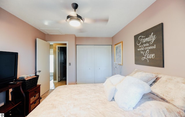 11255 E Fort Rd Unit H1, Suttons Bay, MI 49682 - bedroom with a closet, attic access, and a ceiling fan